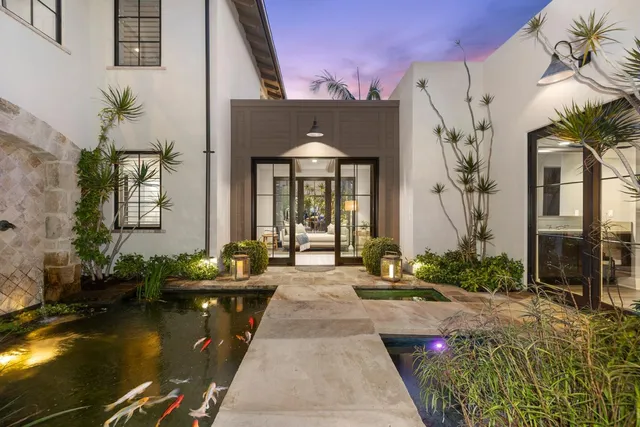 a front view of a house with swimming pool