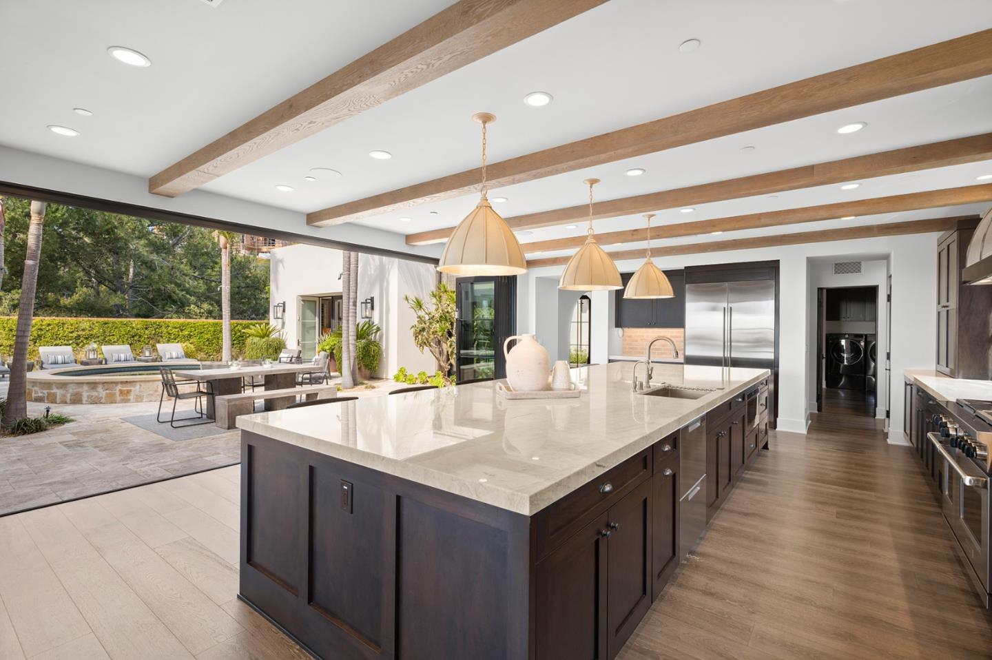 2 Water Port Newport Coast, CA 92657 - Photo 6 of 32 a large kitchen with kitchen island a large counter top space and stainless steel appliances
