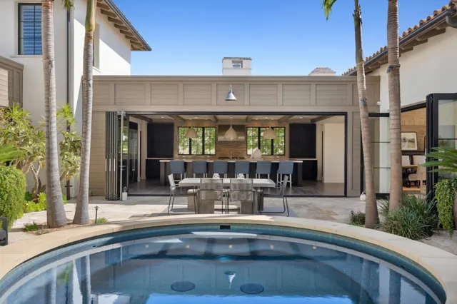 a view of swimming pool with outdoor seating