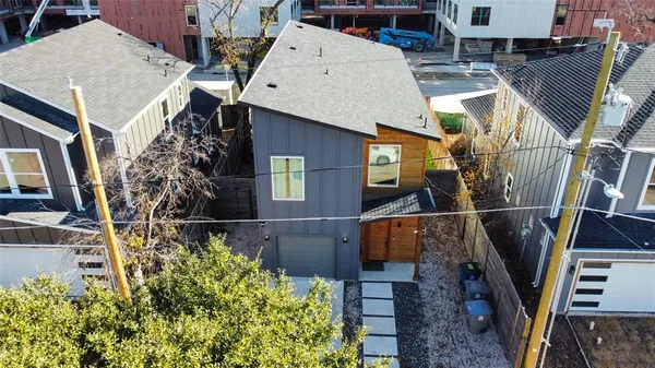 a view of a house with backyard and patio