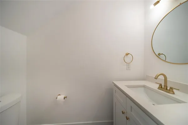 a bathroom with a sink and mirror