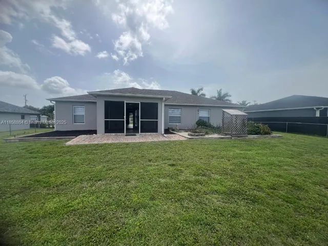 a front view of a house with a garden and porch