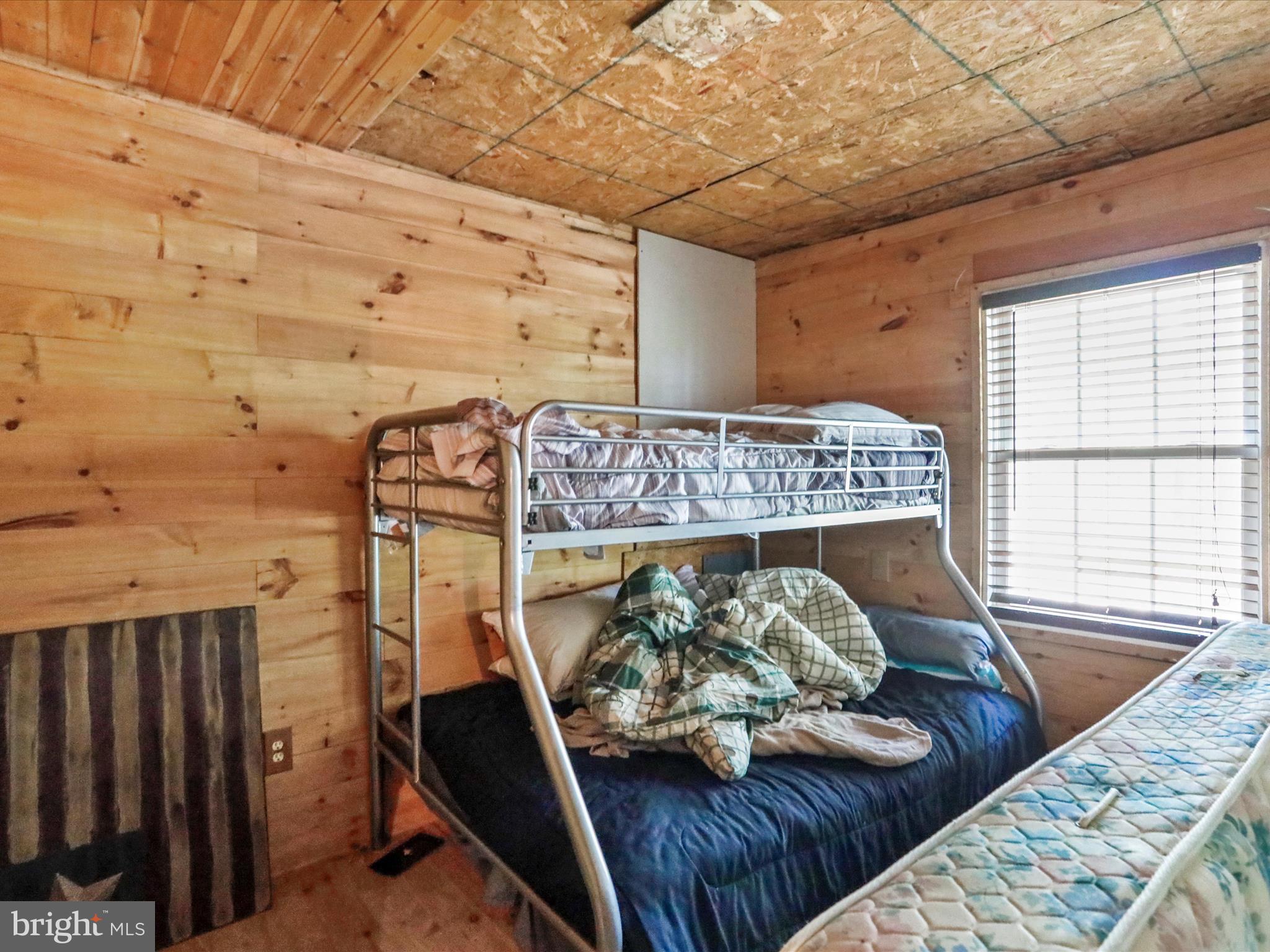 2180 Old Smith Farm Road Springfield, WV 26763 - Photo 13 of 24 a bedroom with furniture and a bed