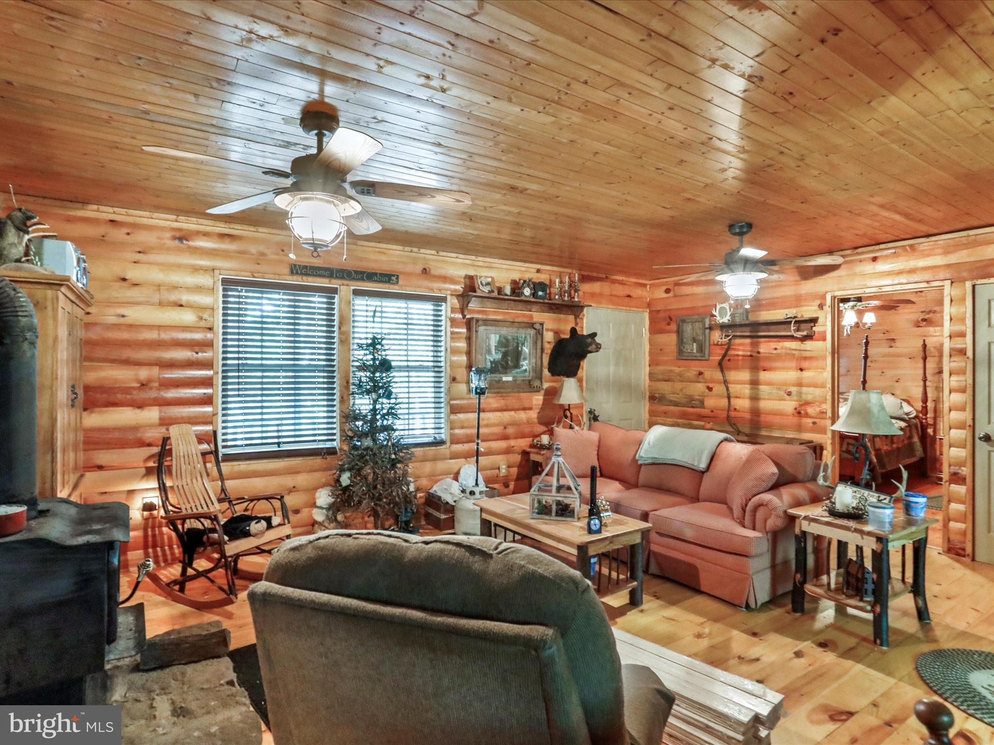 2180 Old Smith Farm Road Springfield, WV 26763 - Photo 7 of 24 a living room with furniture and a large window