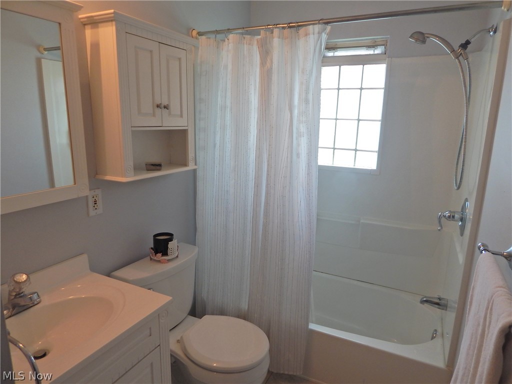 5701 Ackley Road Parma, OH 44129 - Photo 7 of 31 Fresh, Remodeled Bath has Porcelain Floors, Newer Vanity, Toilet and fixtures.