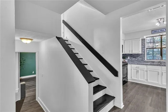 a kitchen with cabinets and window