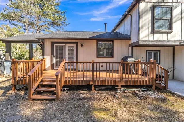 a view of wooden house with a yard