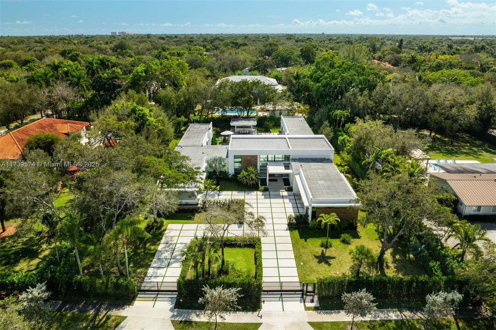 6830 Southwest 104th Street Pinecrest, FL 33156 - Photo 50 of 59 an aerial view of a house with a yard