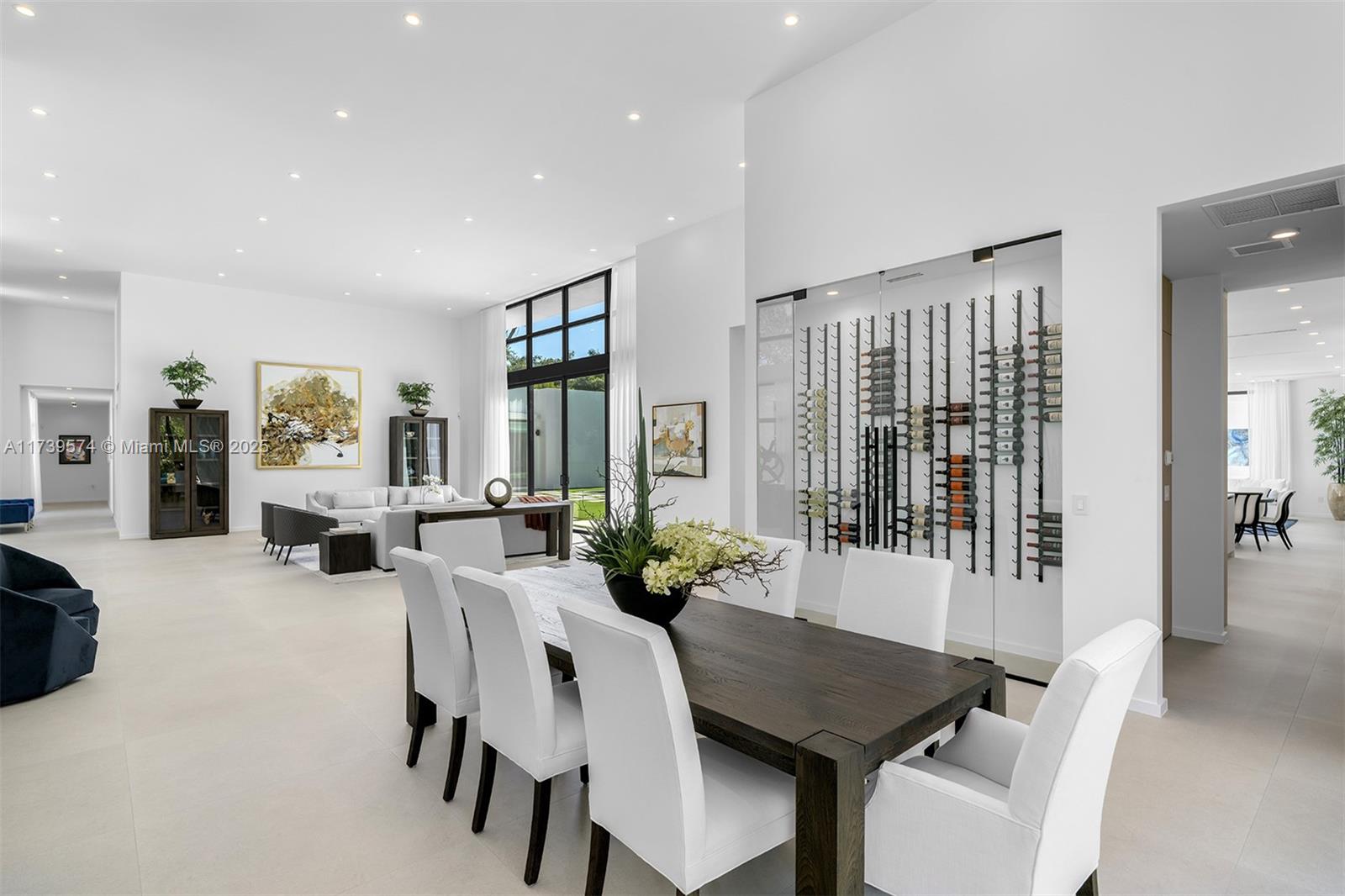 6830 Southwest 104th Street Pinecrest, FL 33156 - Photo 6 of 59 a view of a dining room with furniture window and wooden floor