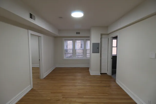 a kitchen with a sink and wooden cabinets