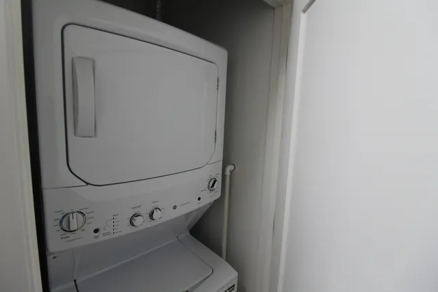 a bathroom with a shower a toilet and sink