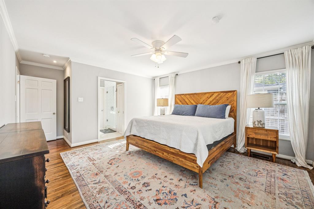 6342 Anita Street Dallas, TX 75214 - Photo 18 of 26 a bed sitting in a spacious bedroom next to a window