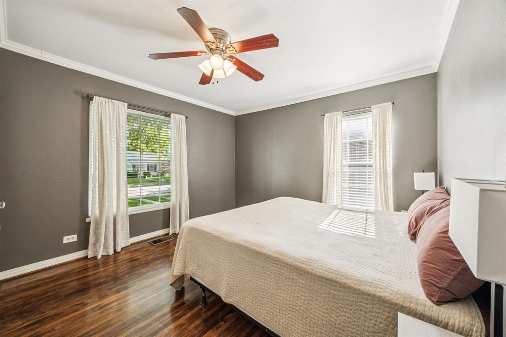 6342 Anita Street Dallas, TX 75214 - Photo 23 of 26 a bedroom with a large bed and a large window