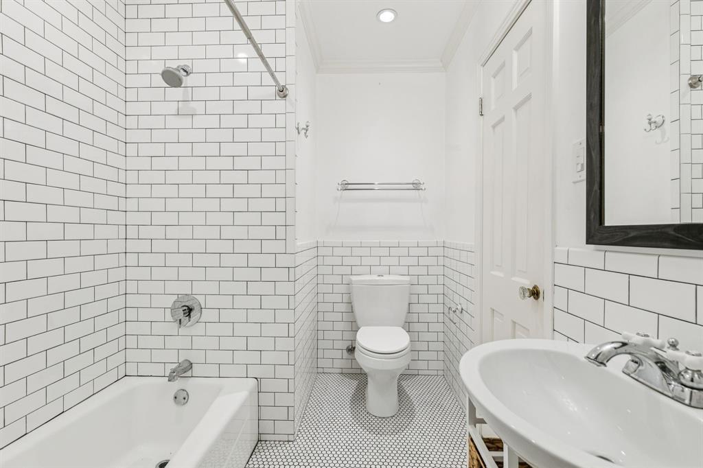 6342 Anita Street Dallas, TX 75214 - Photo 25 of 26 a bathroom with a sink a toilet and shower
