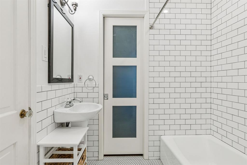 6342 Anita Street Dallas, TX 75214 - Photo 26 of 26 a bathroom with a sink a toilet and bathtub