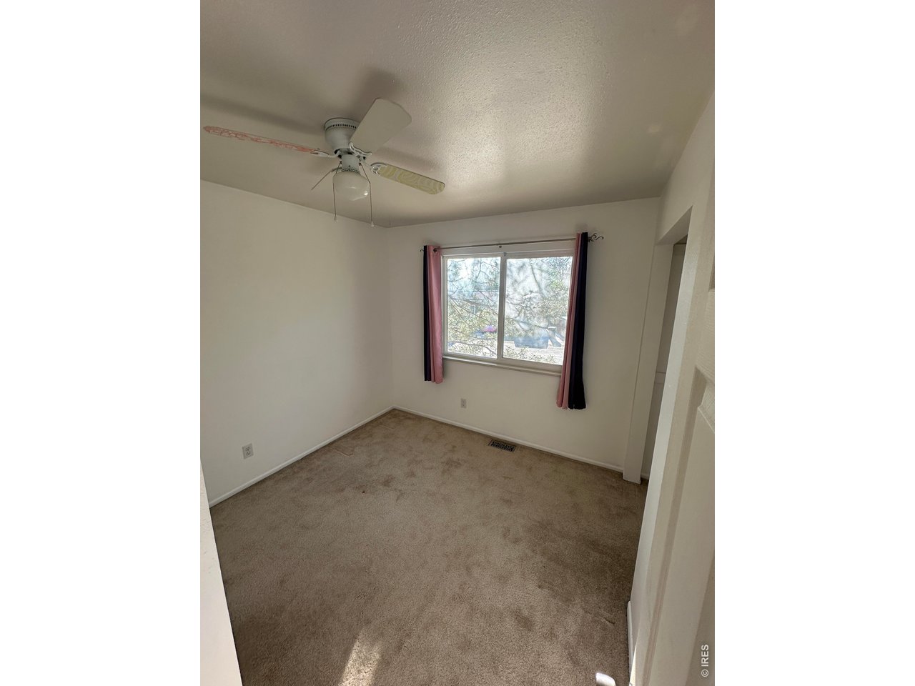 268 Fifth Street Firestone, CO 80520 - Photo 15 of 25 a view of an empty room with a window