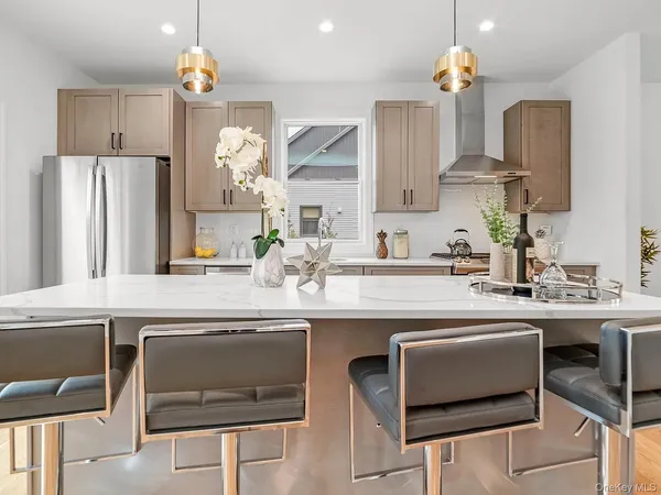 a kitchen with a sink cabinets and window