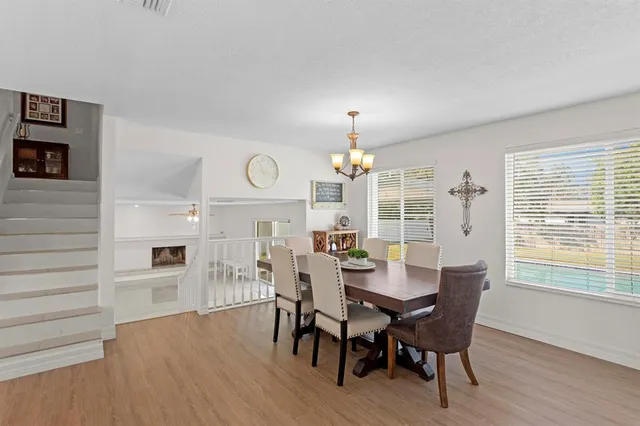 a view of a livingroom with a ceiling fan and window