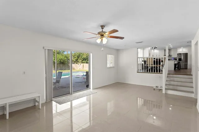 a view of an empty room with a fireplace