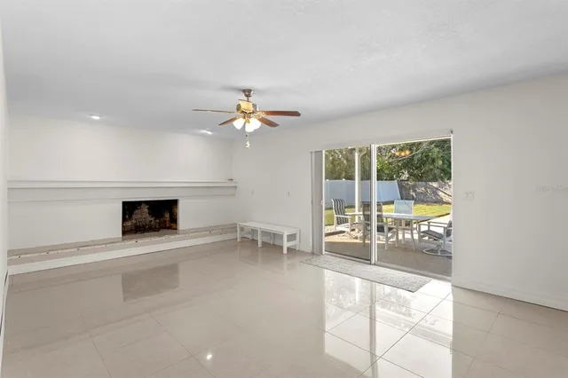 wooden floor in an empty room with a fireplace