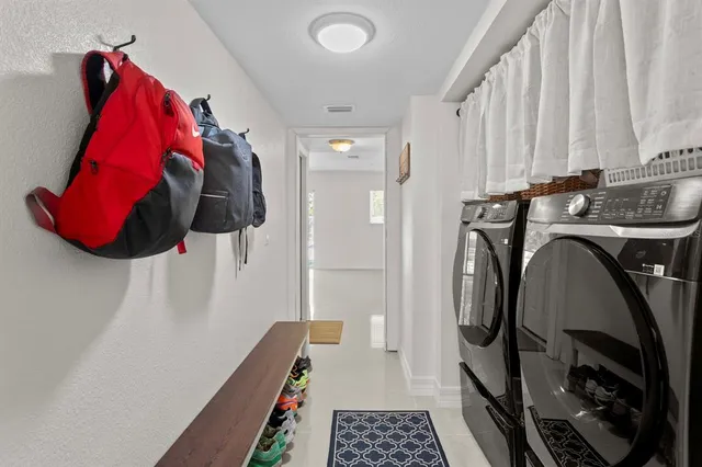 a utility room with dryer and washer