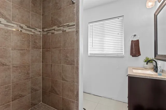 a view of a livingroom with wooden floor and stairs