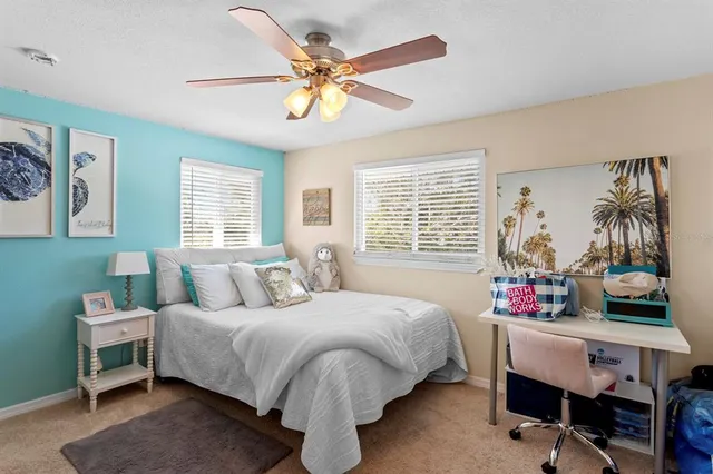 a bedroom with bed and a window