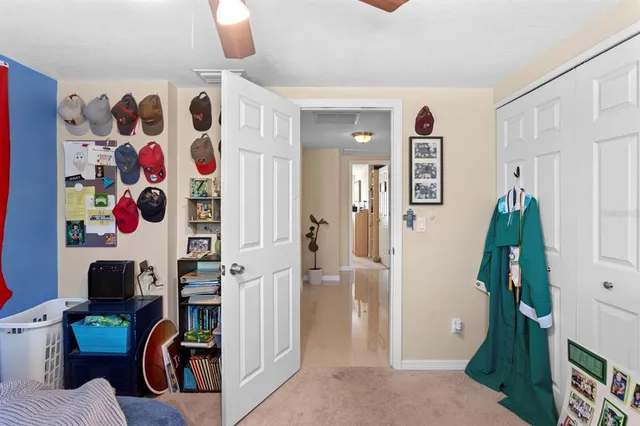 a bathroom with a sink a toilet a mirror and shower curtain