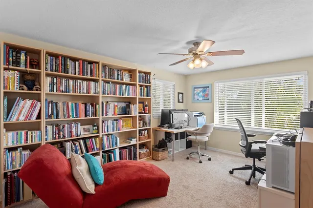 a view of swimming pool with outdoor seating and yard