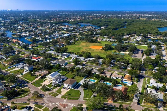 an aerial view of a house with yard swimming pool and outdoor seating