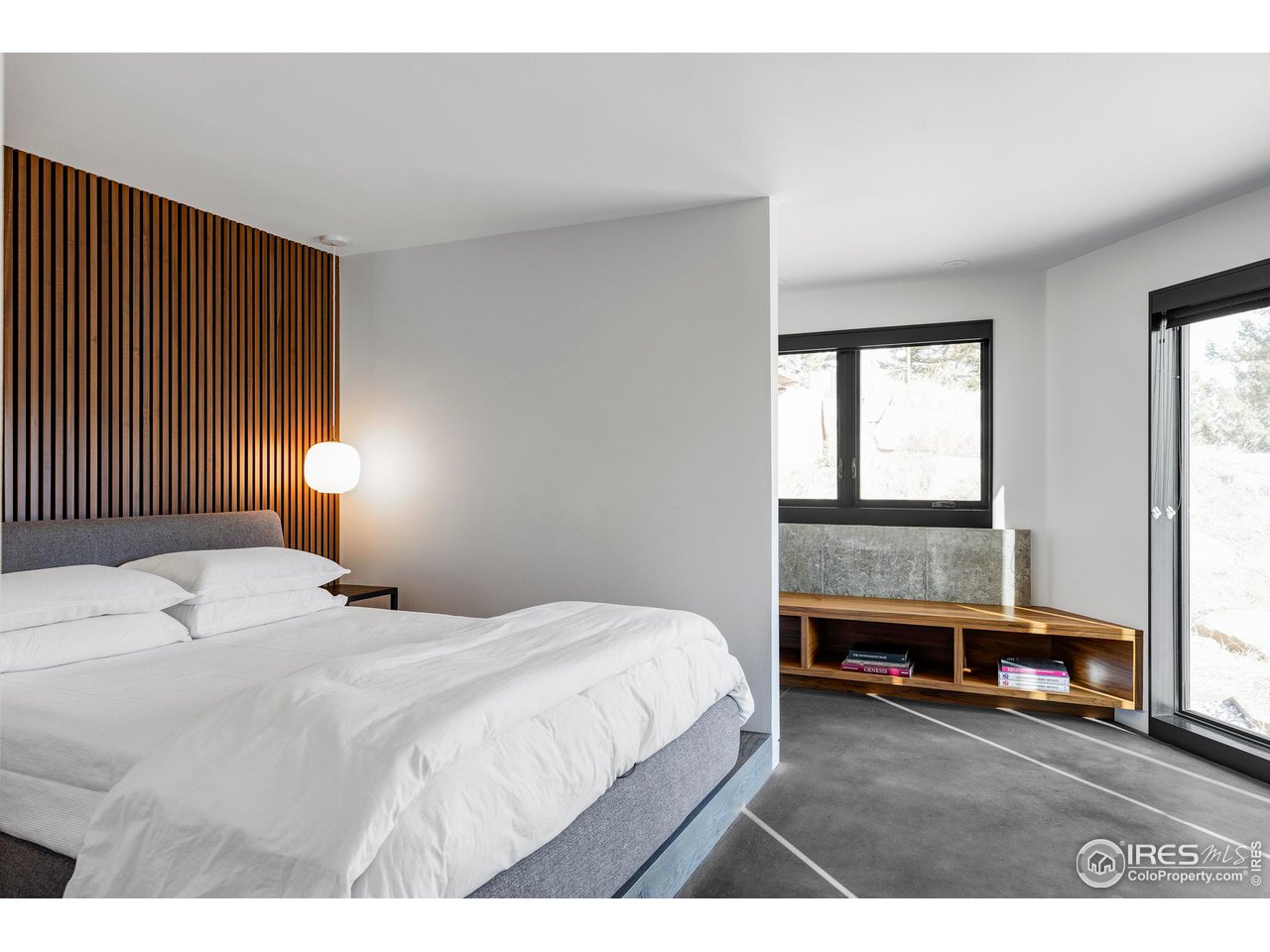 3500 Bison Drive Boulder, CO 80025 - Photo 28 of 37 a bedroom with a bed and a large window