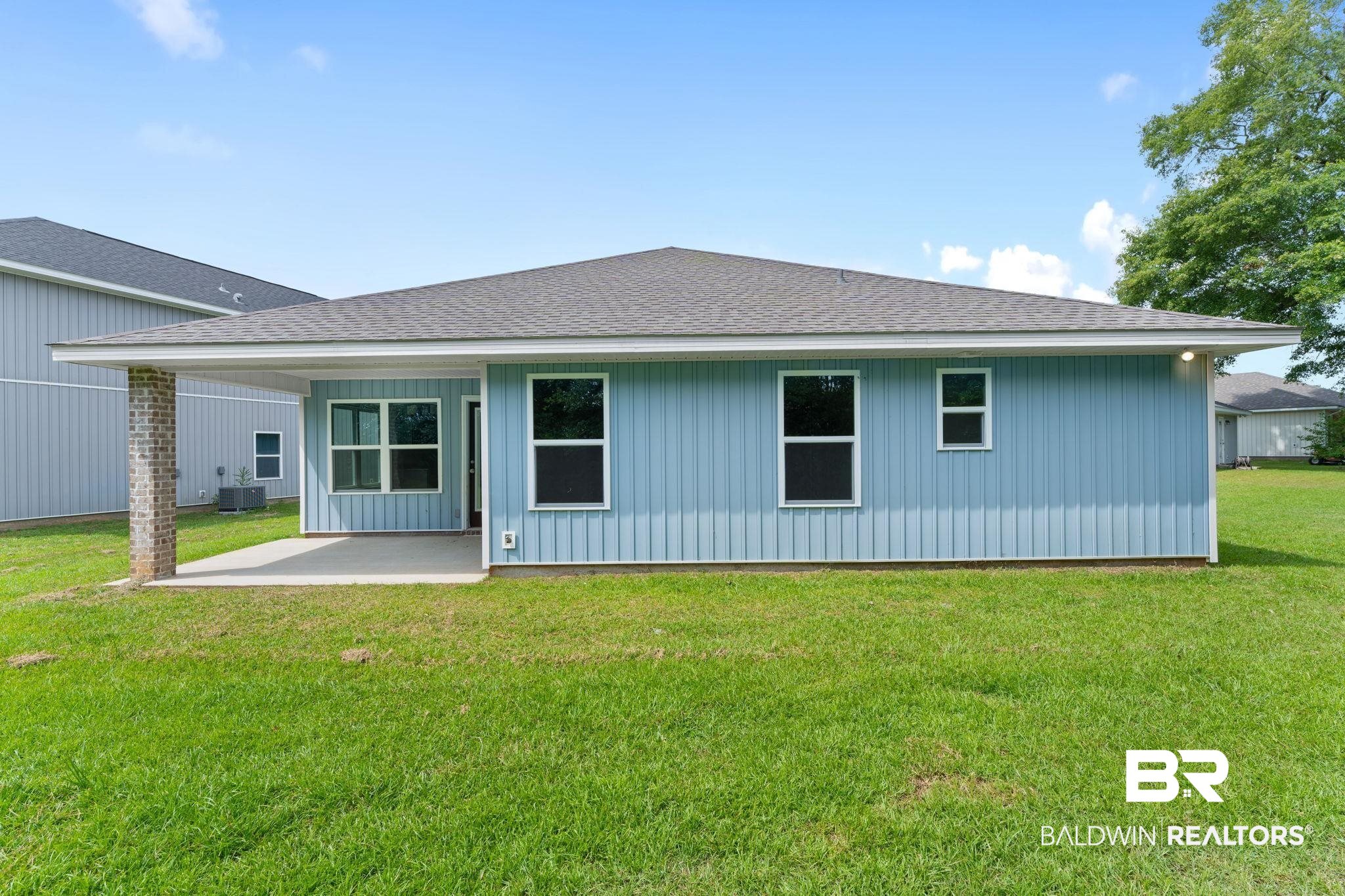 140 St Stephens Court Atmore, AL 36502 - Photo 14 of 14 Rear view of property with a patio area, central AC, and a lawn