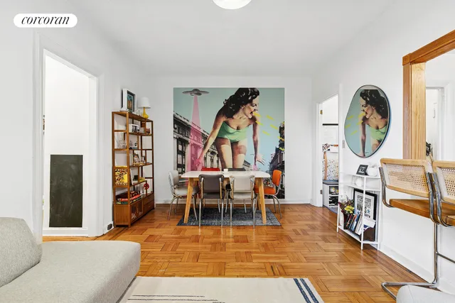 a living room with furniture a rug and a clock