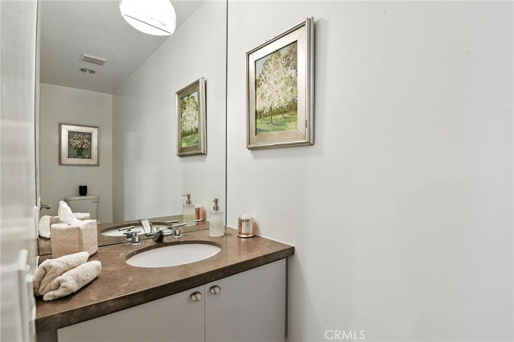 2203 3rd Street, Unit 1 Santa Monica, CA 90405 - Photo 15 of 46 a bathroom with a sink and a mirror