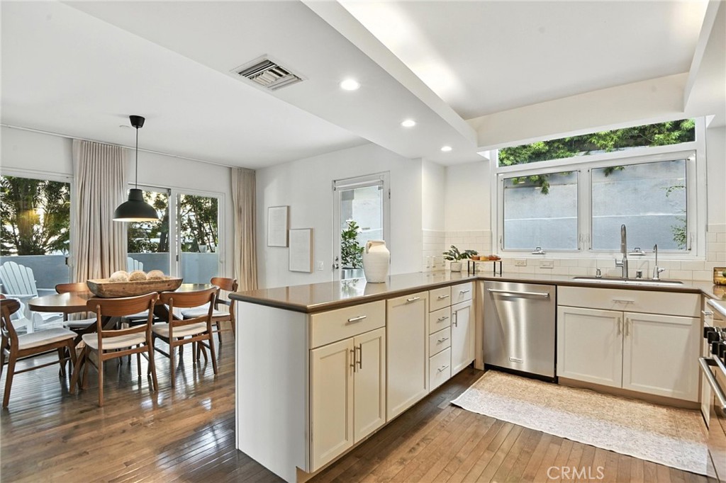 2203 3rd Street, Unit 1 Santa Monica, CA 90405 - Photo 2 of 46 a large kitchen with cabinets and wooden floor