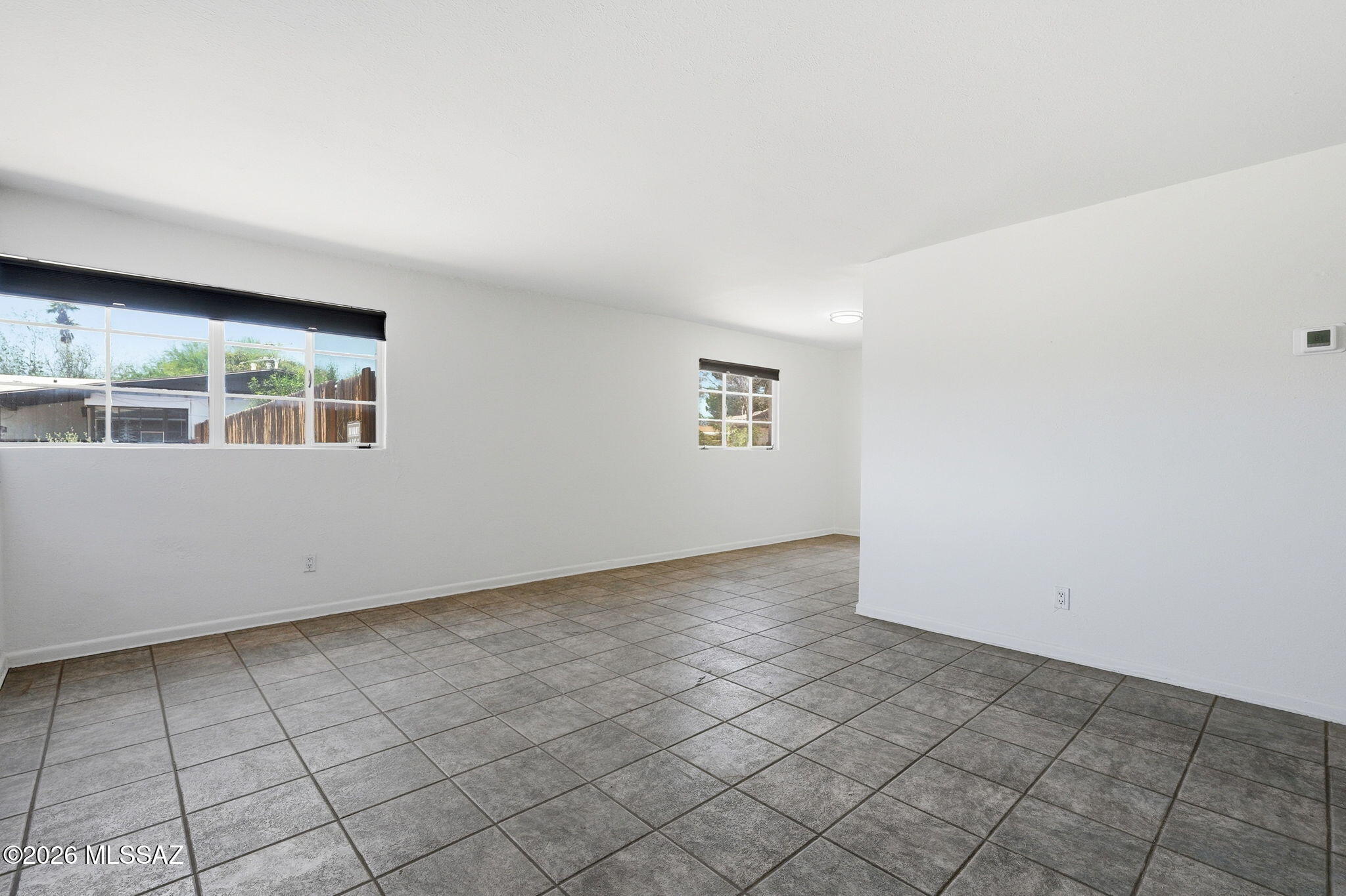 2721 East Fort Lowell Road Tucson, AZ 85716 - Photo 6 of 28 an empty room with windows