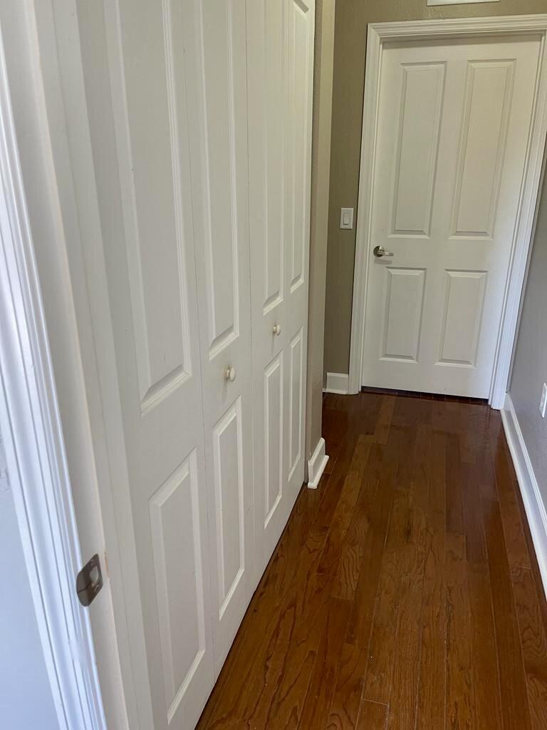 9745 Touchton Road, Unit 1726 Jacksonville, FL 32246 - Photo 24 of 40 a view of a hallway with wooden floor