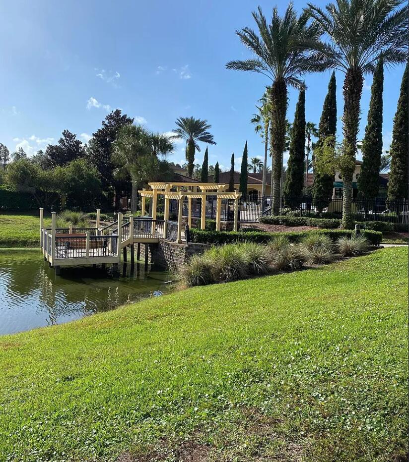 9745 Touchton Road, Unit 1726 Jacksonville, FL 32246 - Photo 33 of 40 a view of a house with a yard and lake view