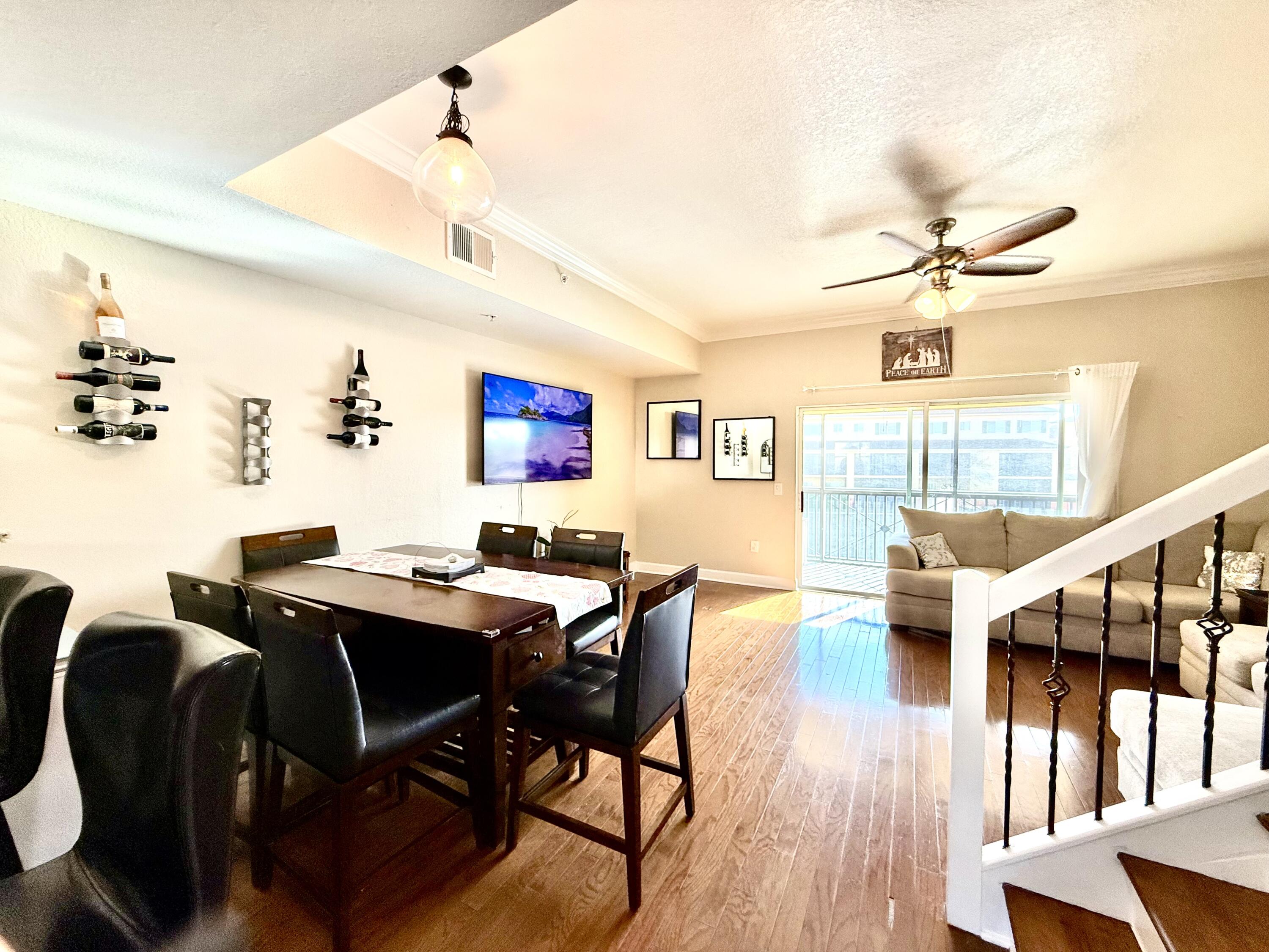 9745 Touchton Road, Unit 1726 Jacksonville, FL 32246 - Photo 8 of 40 a view of a dining room with furniture and wooden floor