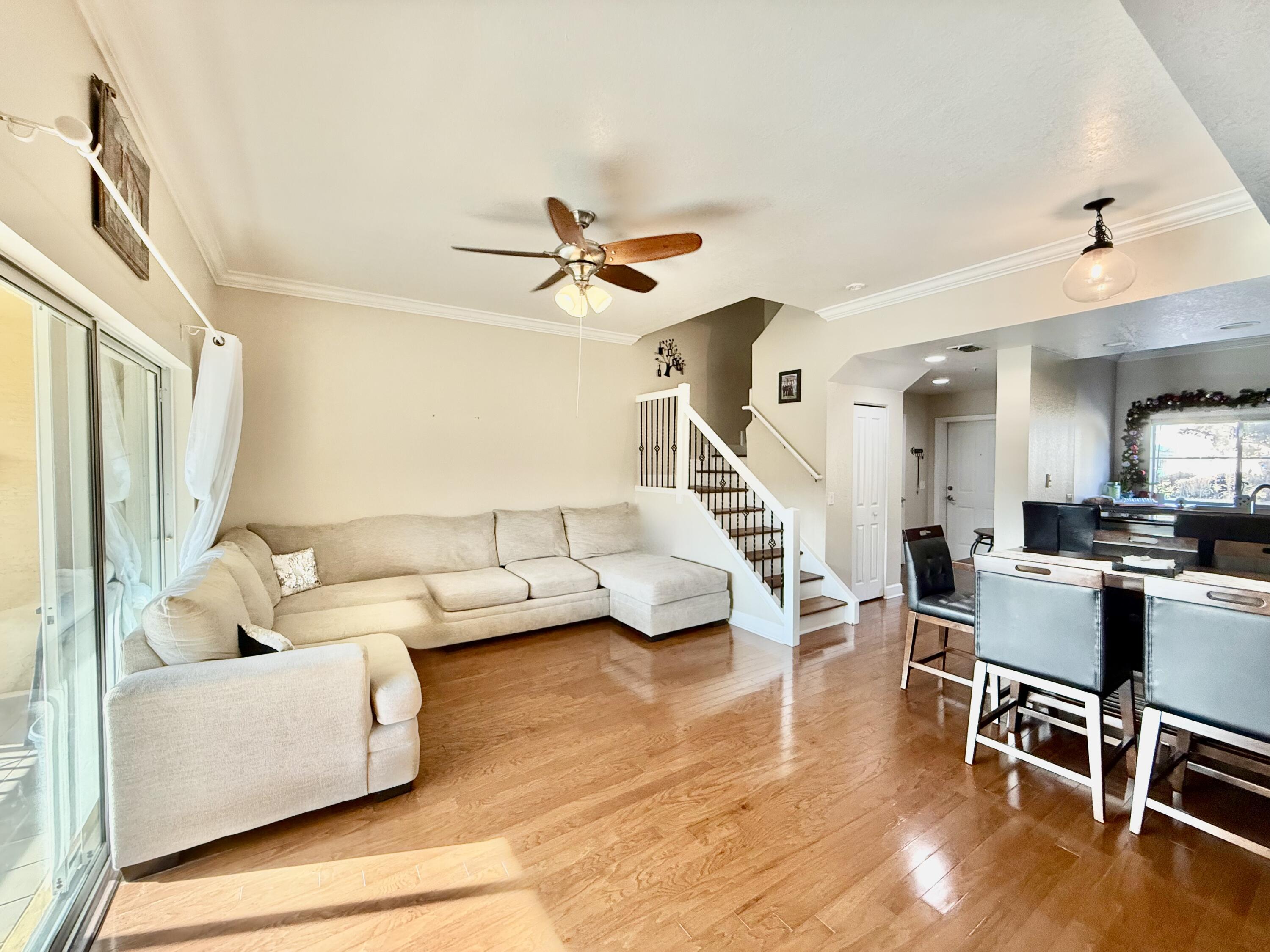 9745 Touchton Road, Unit 1726 Jacksonville, FL 32246 - Photo 10 of 40 a living room with furniture and a wooden floor