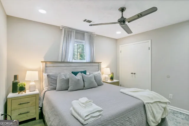 a bedroom with a bed and a window