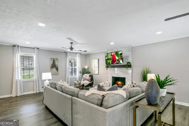 a living room with fireplace furniture and a fireplace