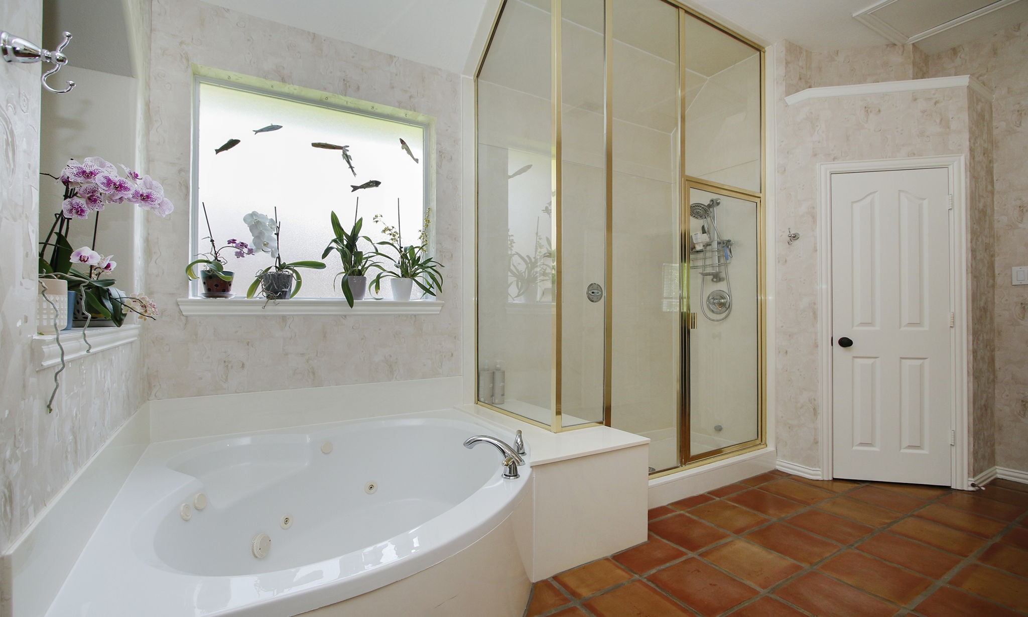 20110 Stormy Pine Lane Spring, TX 77379 - Photo 26 of 44 Alternate angle highlighting the jetted soaking tub paired with an elegant, full-height glass shower enclosure.