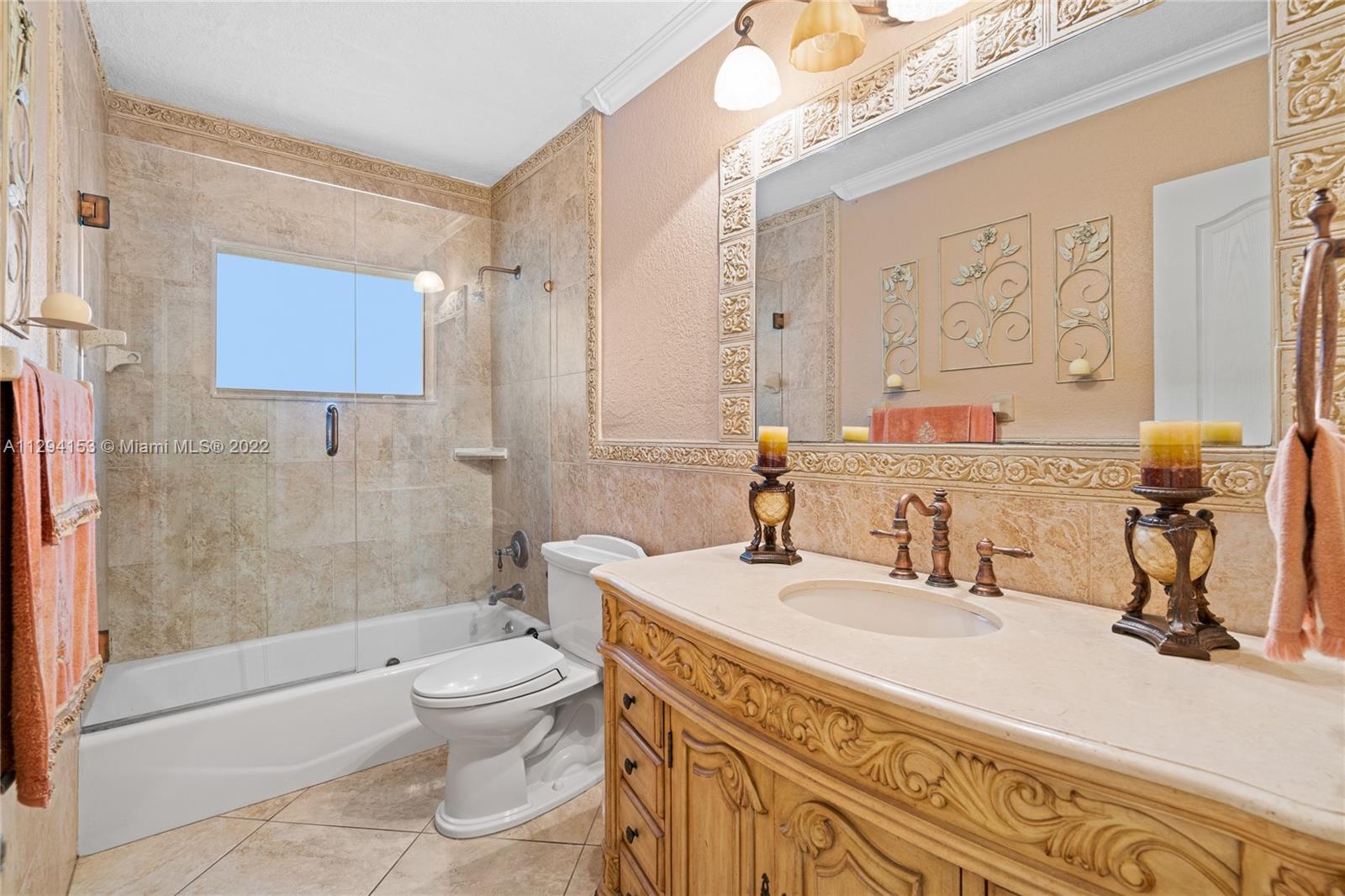 9901 Southwest 35th Terrace Miami, FL 33165 - Photo 23 of 50 a bathroom with a sink a toilet and shower