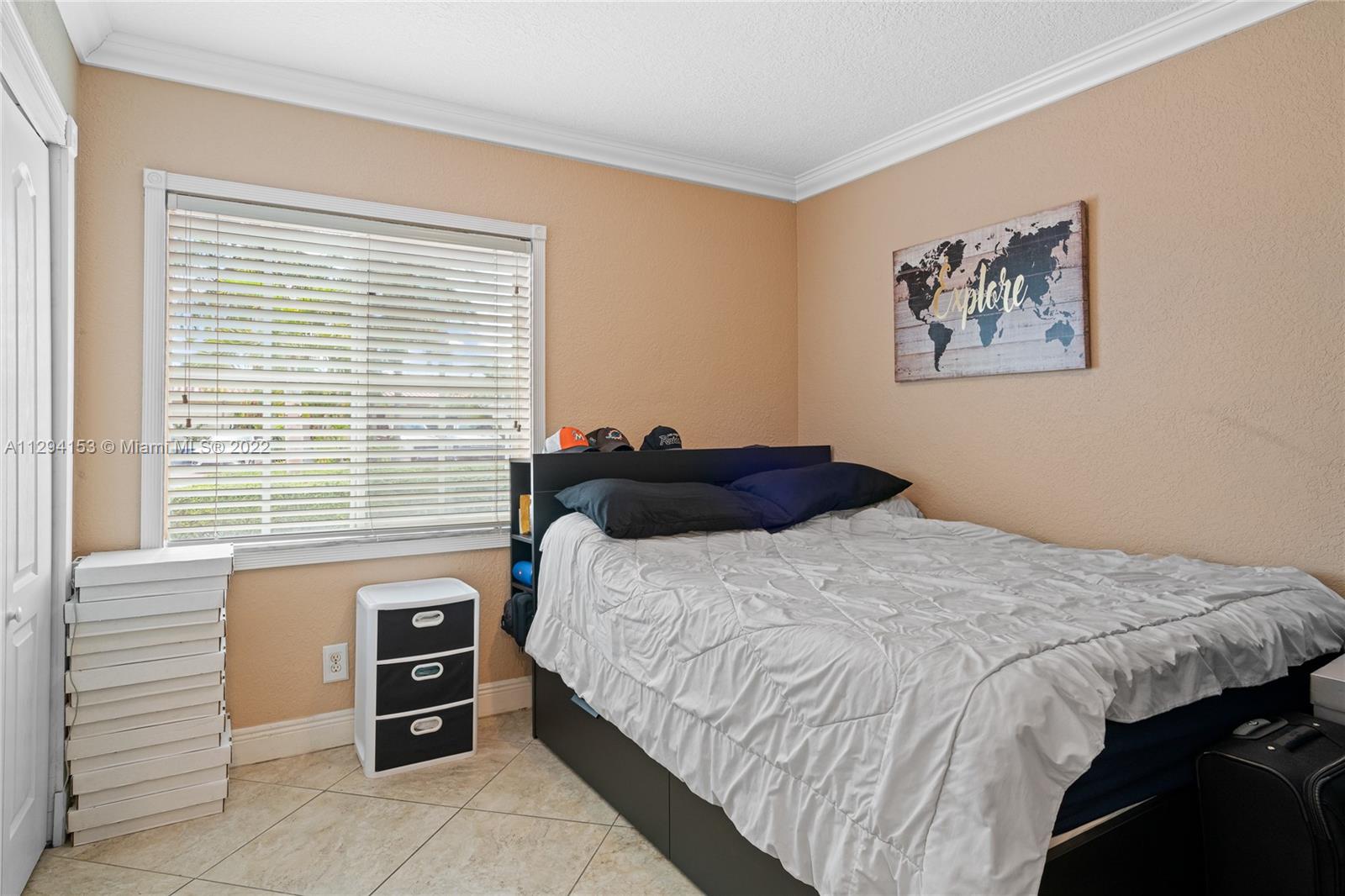 9901 Southwest 35th Terrace Miami, FL 33165 - Photo 24 of 50 a bedroom with a bed and a window