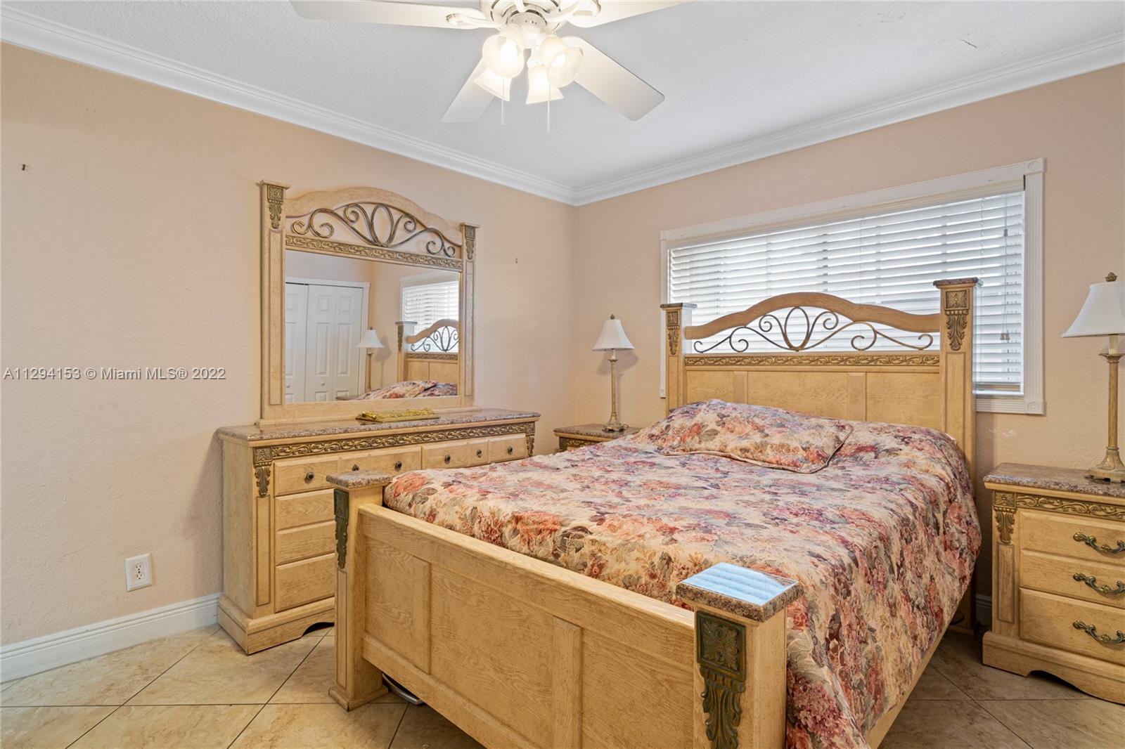 9901 Southwest 35th Terrace Miami, FL 33165 - Photo 25 of 50 a bedroom with a bed and a dresser