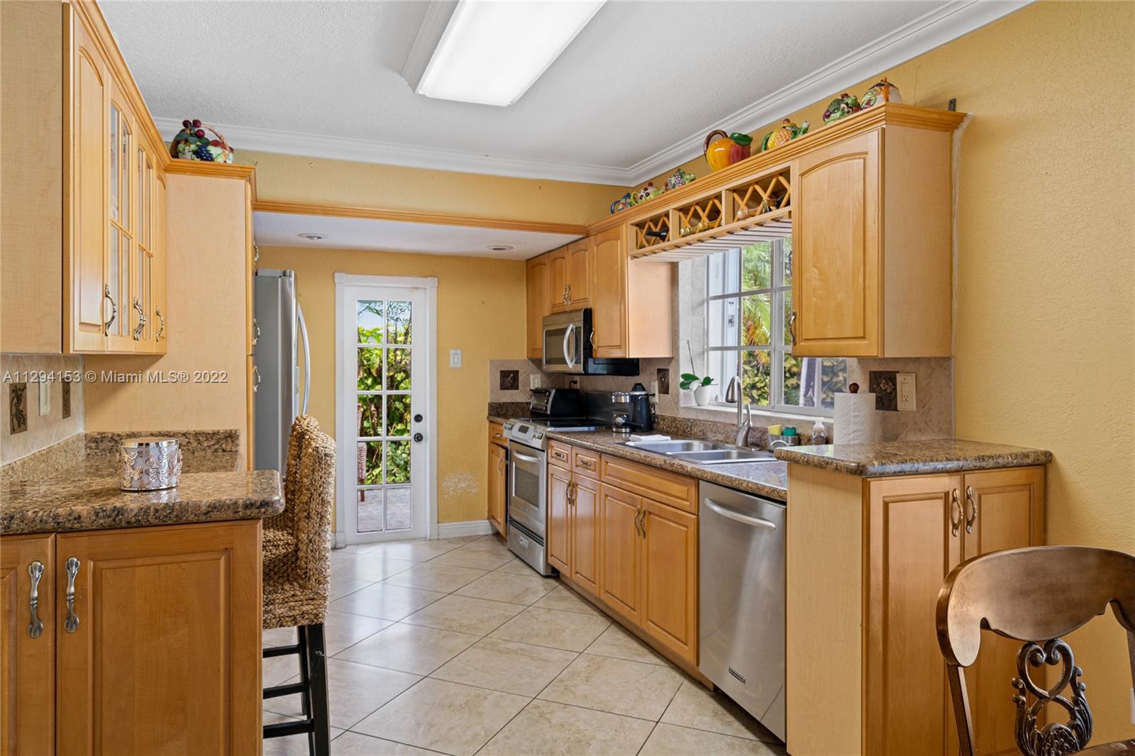 9901 Southwest 35th Terrace Miami, FL 33165 - Photo 30 of 50 a kitchen with a sink cabinets and window