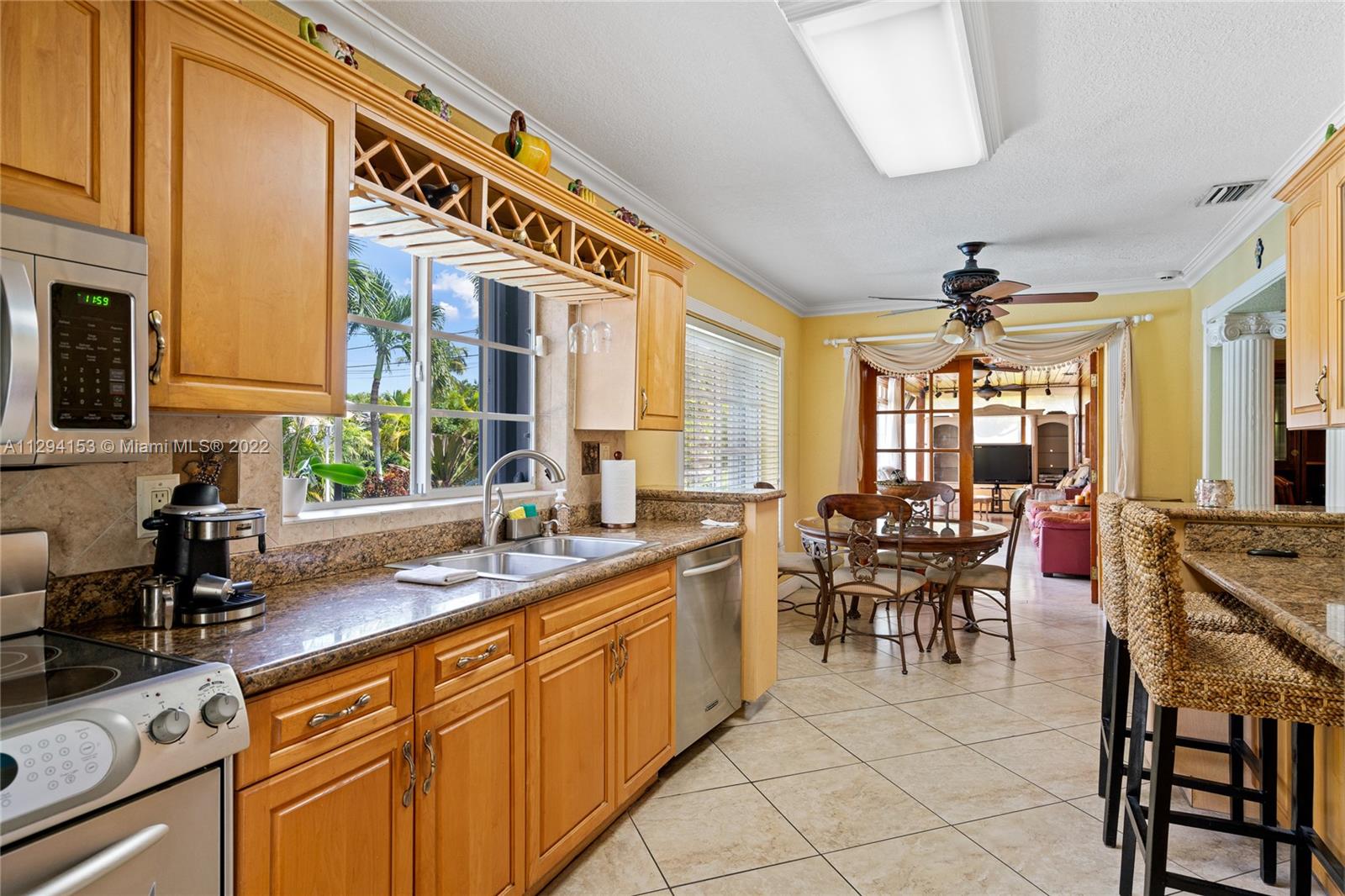 9901 Southwest 35th Terrace Miami, FL 33165 - Photo 32 of 50 a large kitchen with a table and chairs