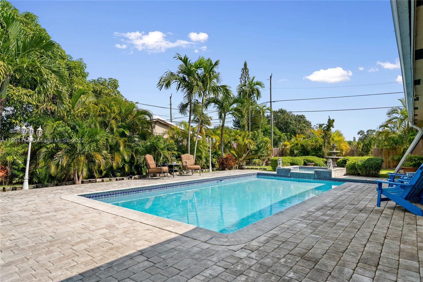 9901 Southwest 35th Terrace Miami, FL 33165 - Photo 39 of 50 a swimming pool with outdoor seating and yard