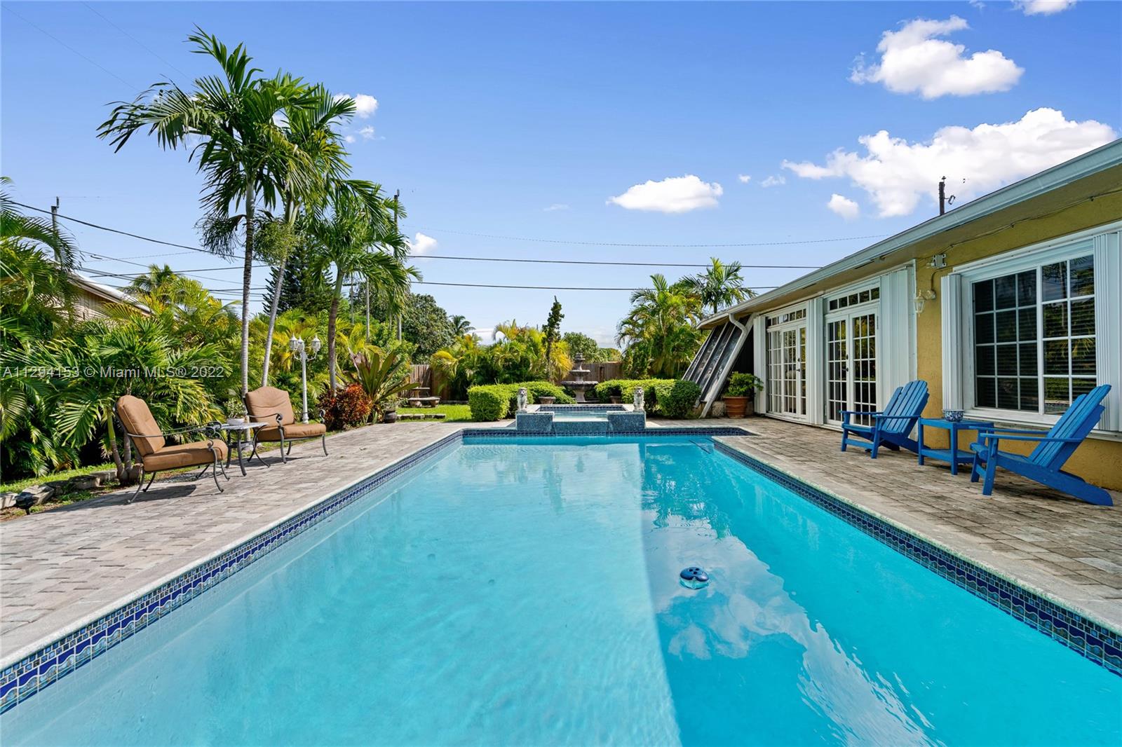 9901 Southwest 35th Terrace Miami, FL 33165 - Photo 40 of 50 a view of a house with swimming pool